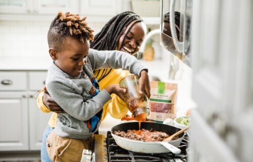 child cooking with mother