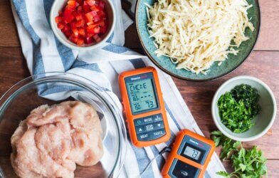 Meat thermometer on a counter with ingredients