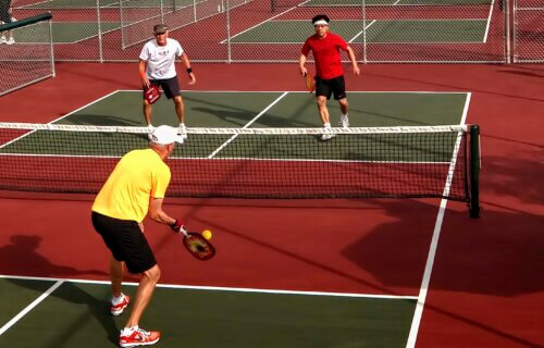 4 players in a pickleball game