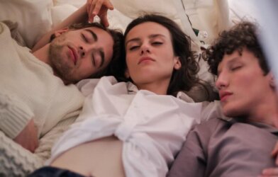 woman sleeping with 2 men