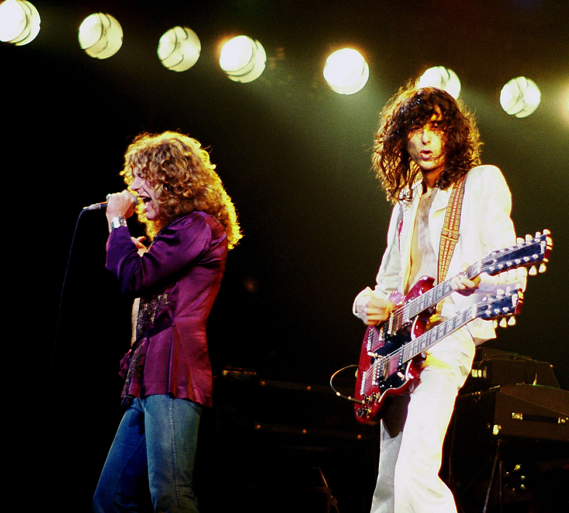 Jimmy Page (left) on stage with Robert Plant (right)