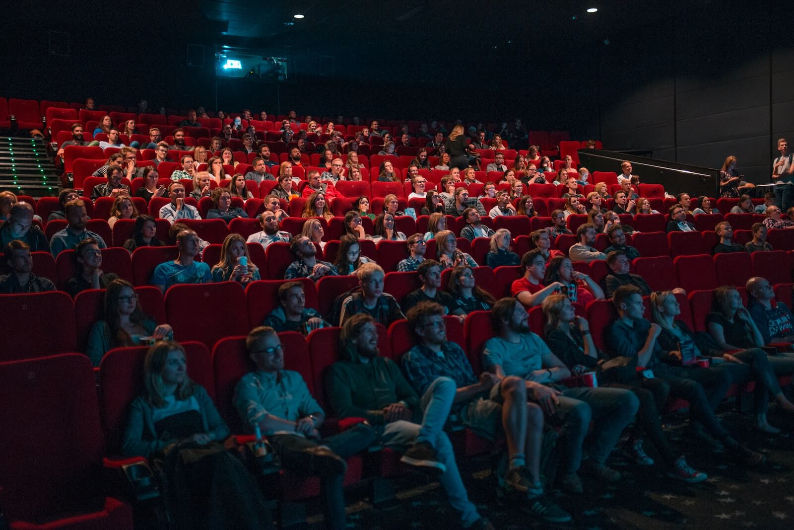 image of audience watching movie in movie theater