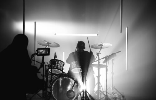 Silhouette of a drummer on stage
