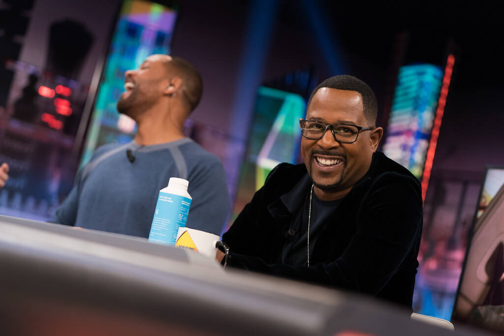 Martin Lawrence and Will Smith laughing on a talk show