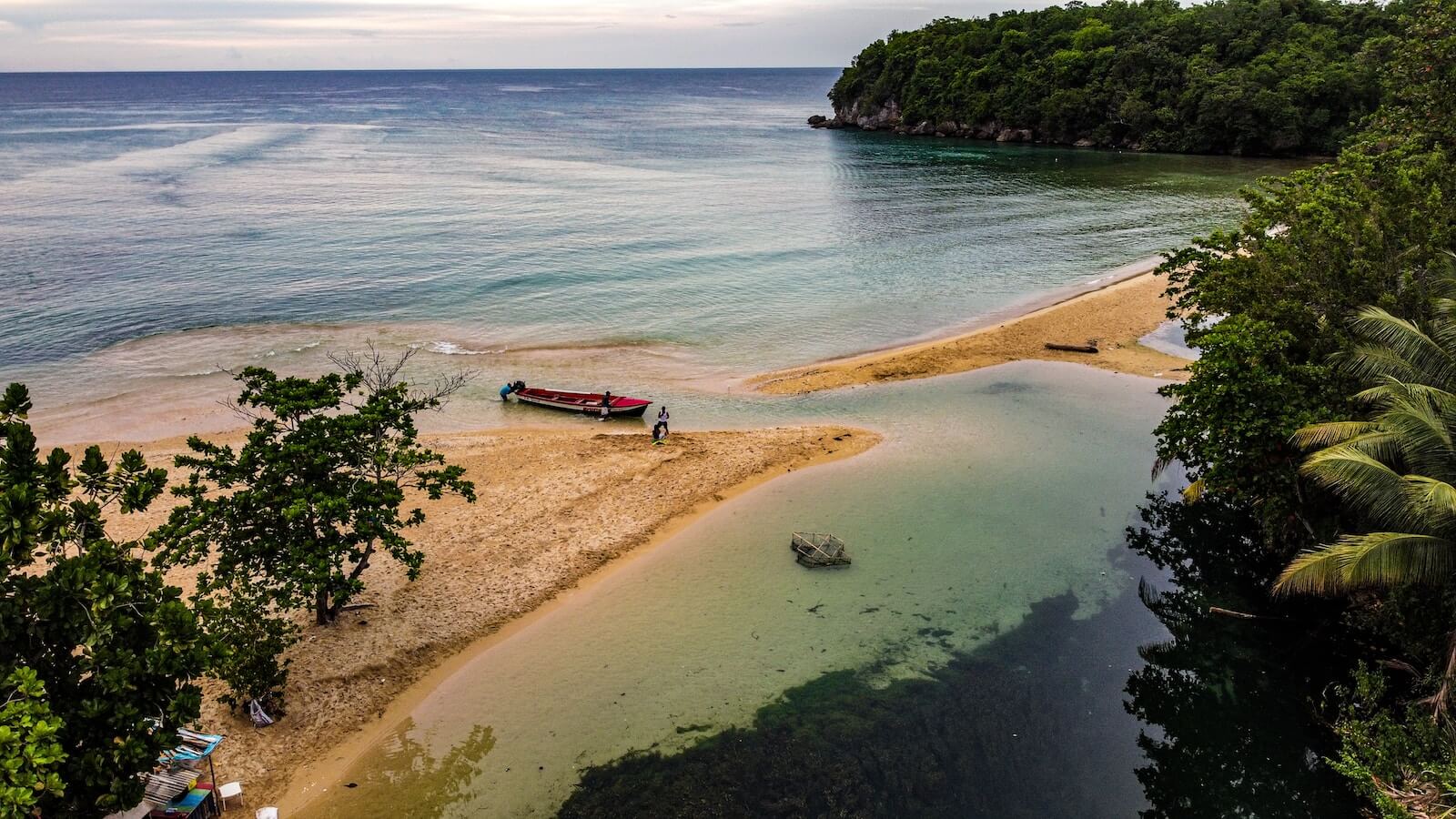 A boat on the shore of a beach in Ochos Rios, Jamaica