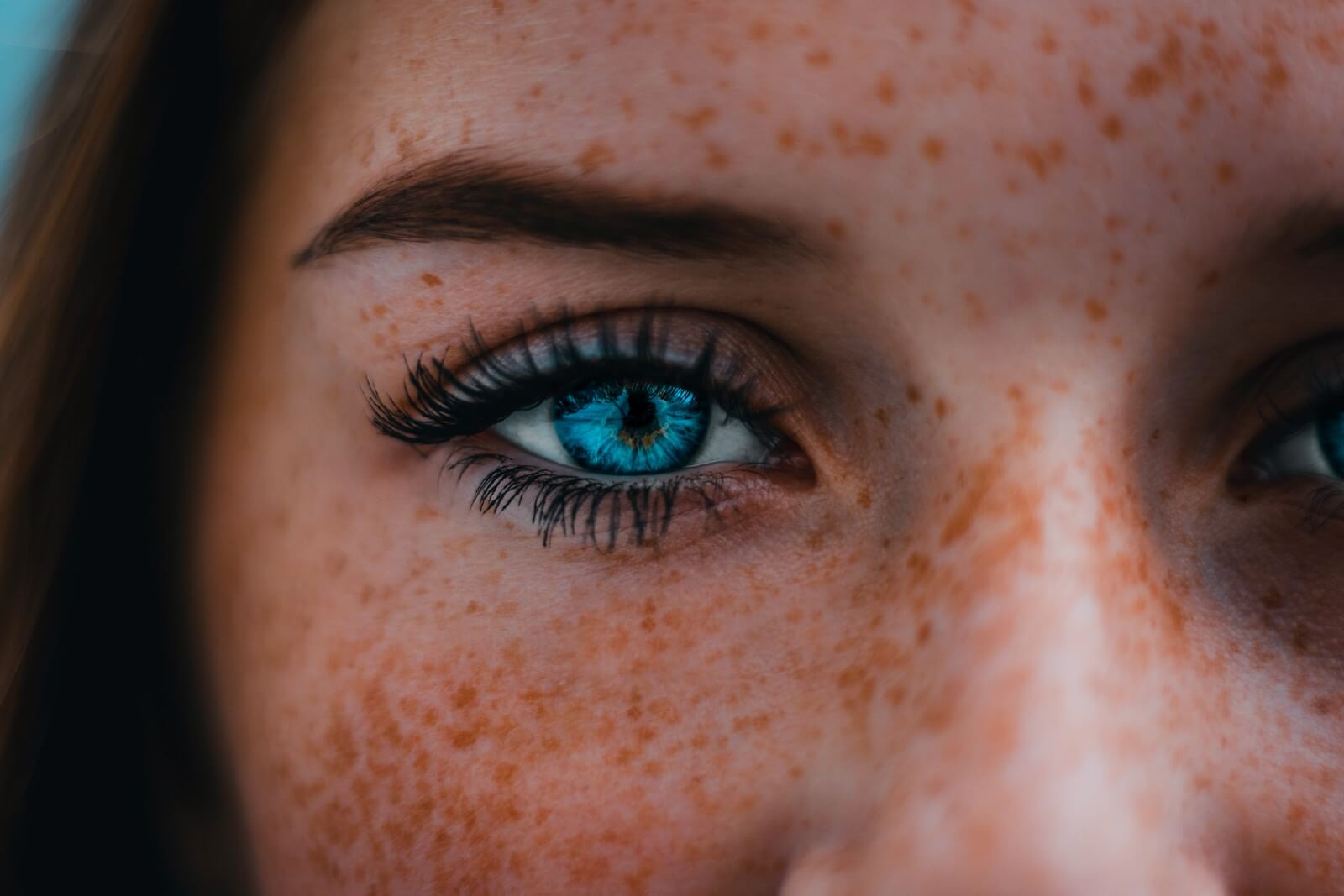 woman with blue eyes wearing mascara