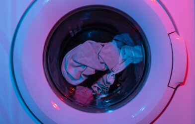 Laundry machine in pink lighting