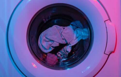 Laundry machine in pink lighting