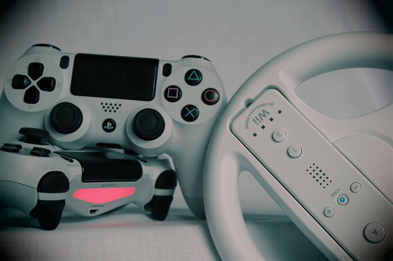 image of gaming controllers and racing wheel controller