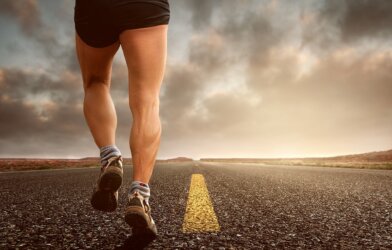 runner's legs jogging on street