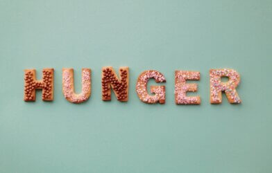 Hunger spelled out in food