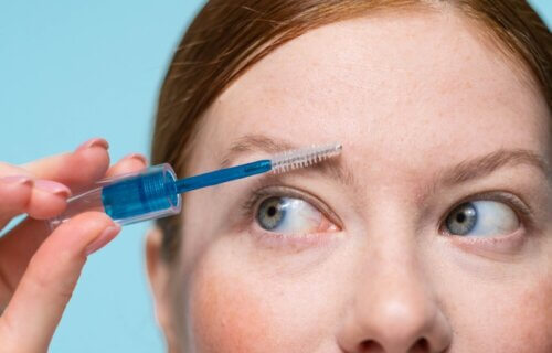Woman applying clear brow gel