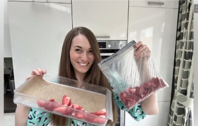 pic of Kate with fresh strawberries and frozen strawberries.