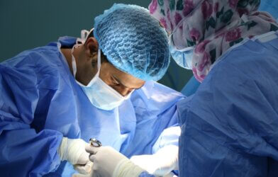 Doctor performing surgery in the operating room