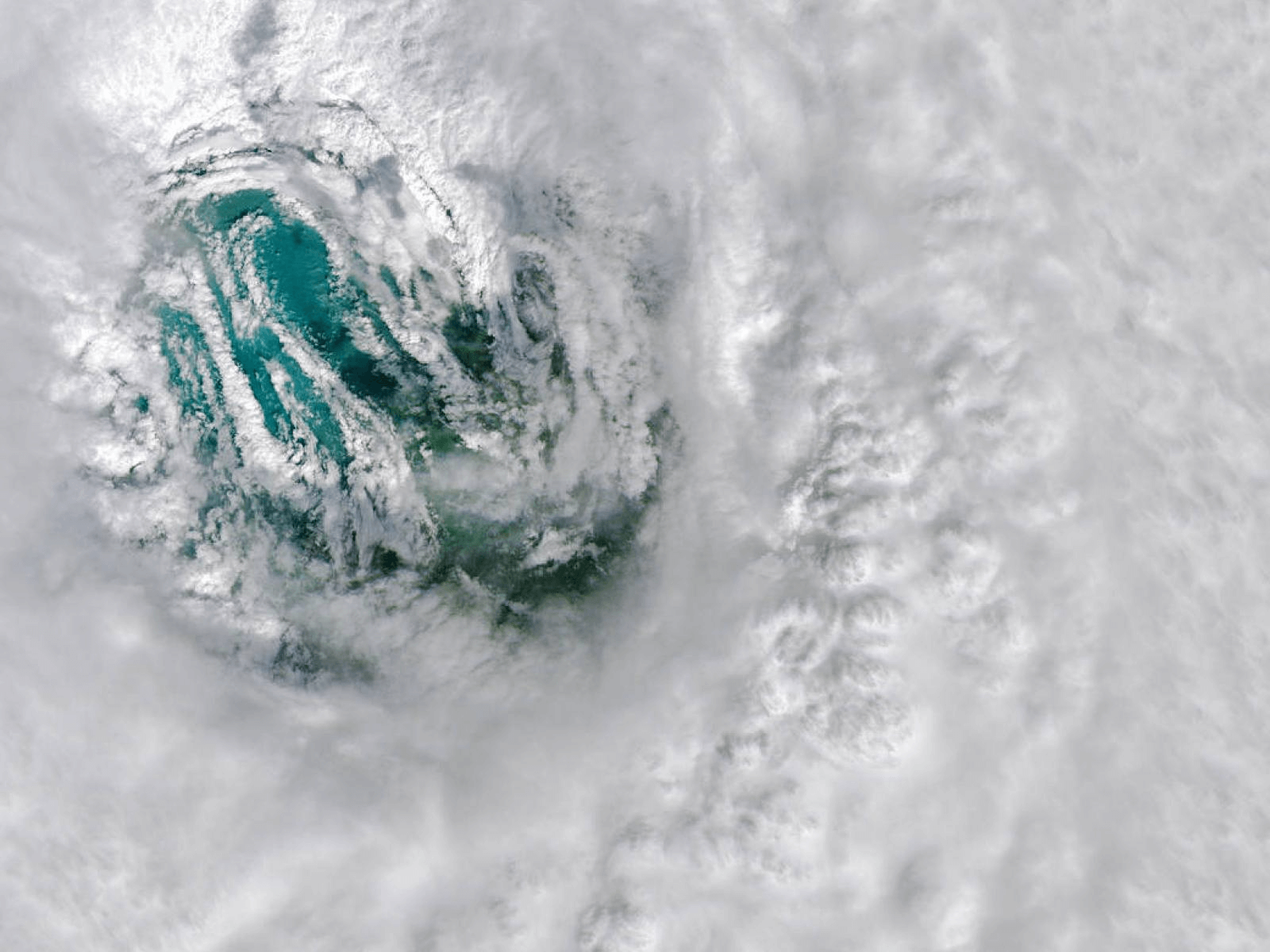 This image depicts the eye of Hurricane Ian. Thick, spinning thunderstorm clouds encircle and form the eye of the storm.close Hurricane Ian, whose wide eye is shown here, is among the strongest storms to strike the U.S. coast. New research finds that rapidly intensifying hurricanes such as Ian will develop faster and grow wetter in a future marked by continued fossil fuel reliance. 
