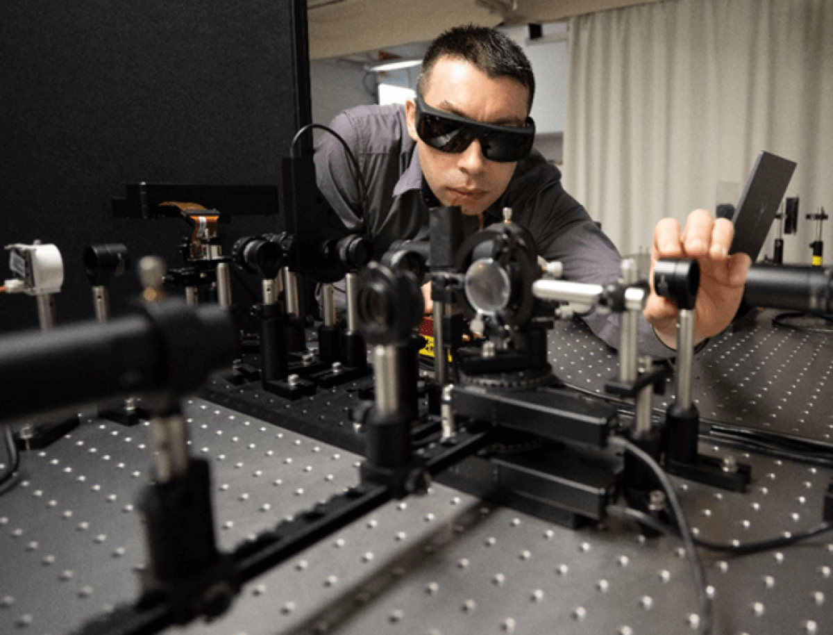 Scientist measuring eyeglass lens