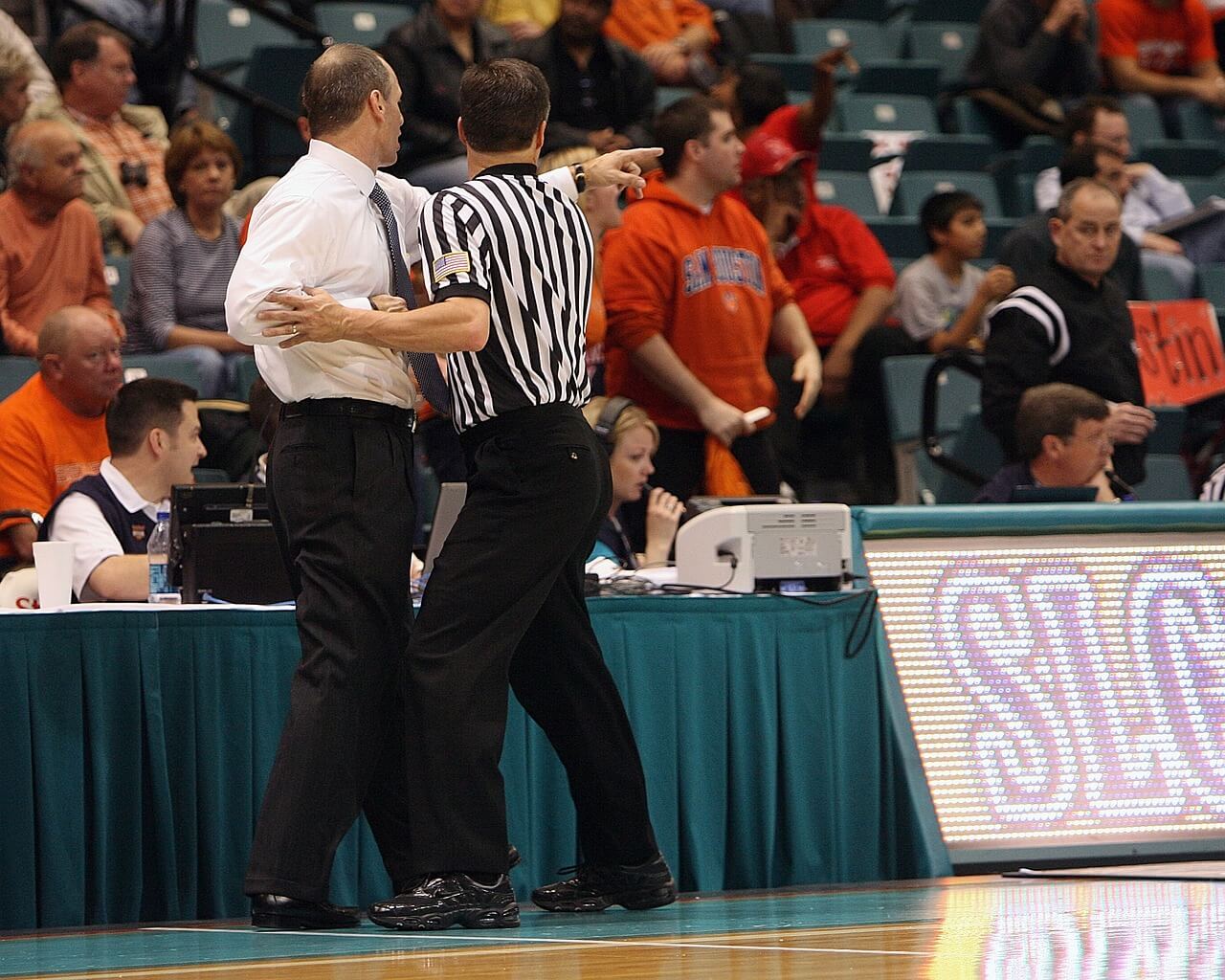 image of basketball coach arguing with refs