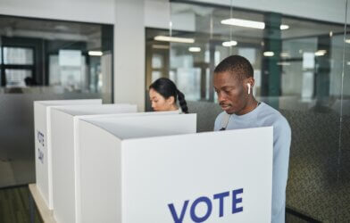 Man in a voting booth