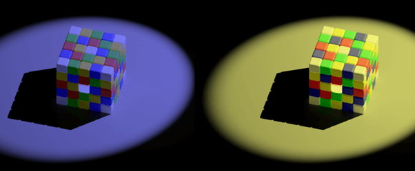 Both cubes have what appear to be yellow and blue tiles on their top surfaces. However, the ones that look yellow on the left are in fact a gray color that is identical to the blue tiles on the right.