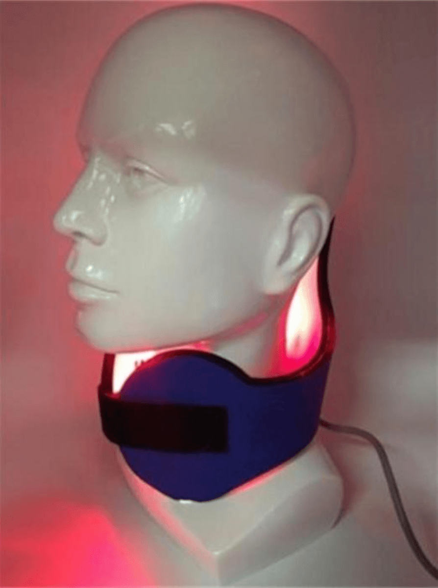 Picture of the device which looks like headphones with red infared light