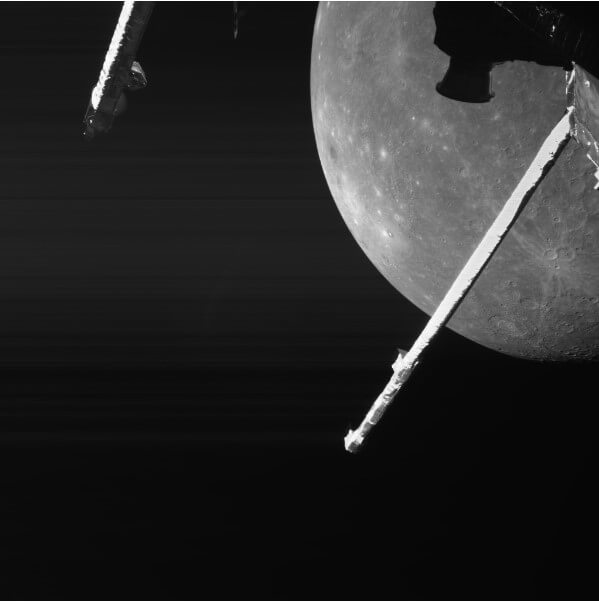 black and white pic.. closeup of the southern half Mercury,.. view of two satellite sticks
