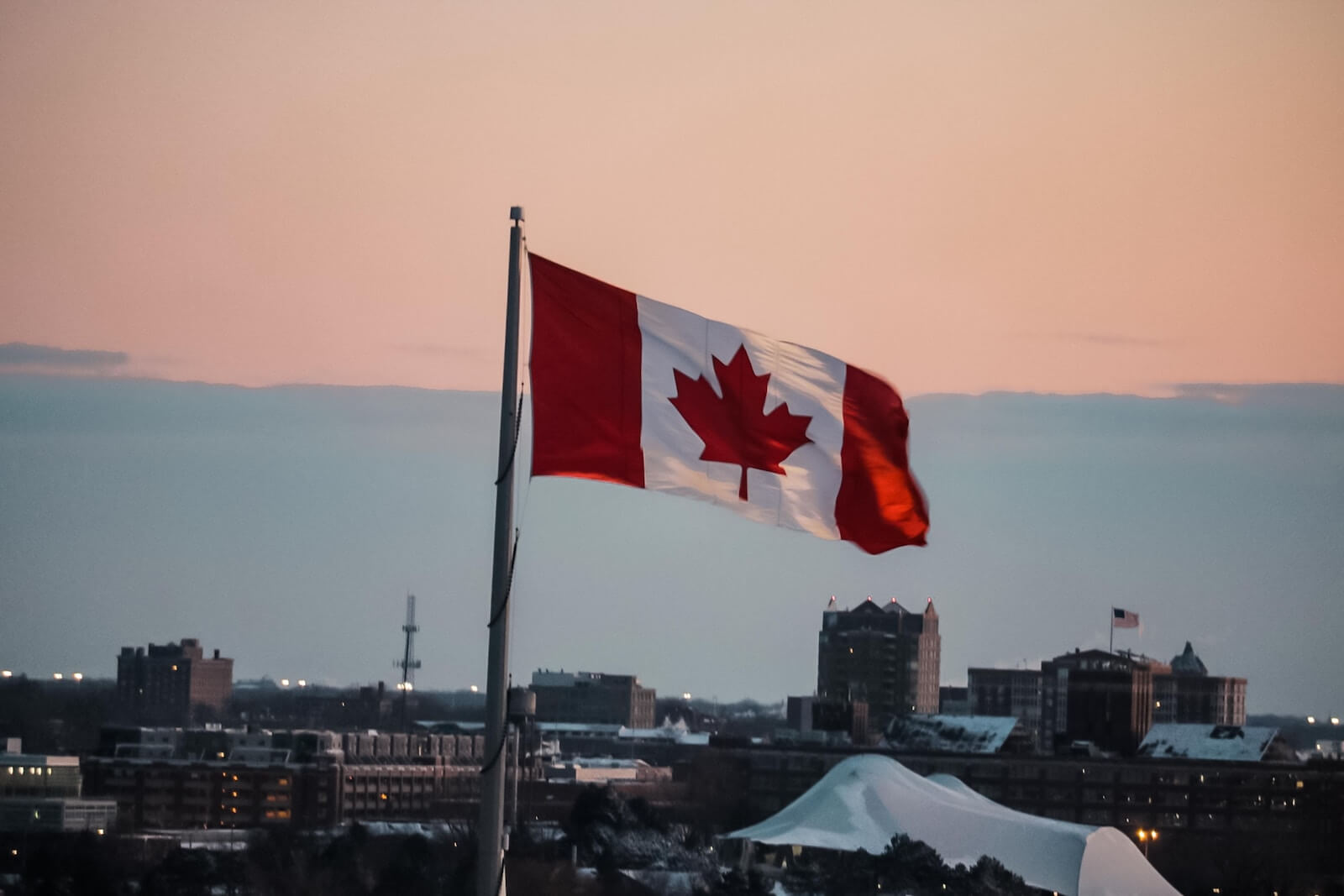 Waving Canada flag photo by sebastiaan stam on Unsplash