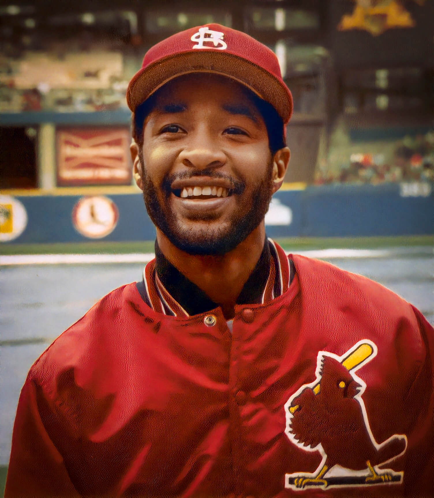 image of young Ozzie Smith smiling into the camera wearing his St. Louis Cardinals uniform