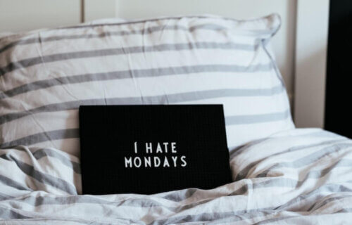 I hate Mondays sign on bed