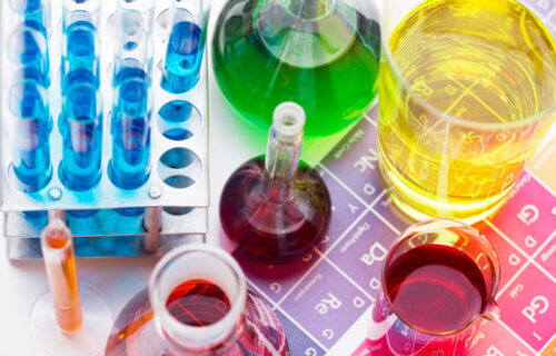 Picture of assortment of chemicals on element chart.