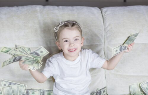 Young girl holding money