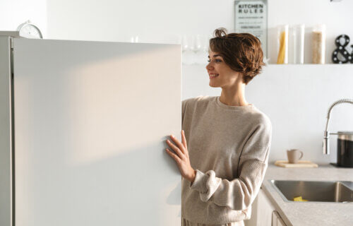 A woman looking in a refrigerator