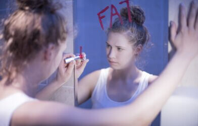 Teen girl in the bathroom with an eating disorder