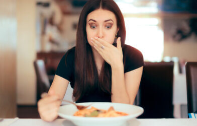 Woman Feeling Sick While Eating Food