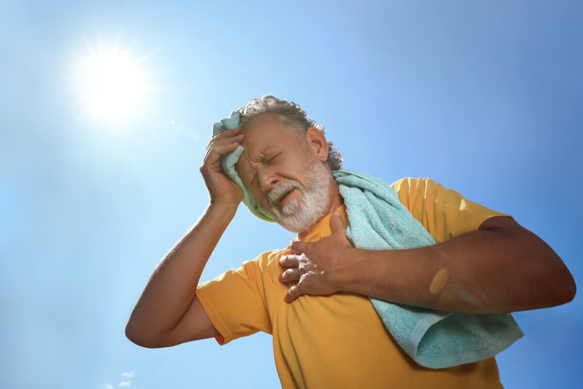 Senior man suffering from heat stroke