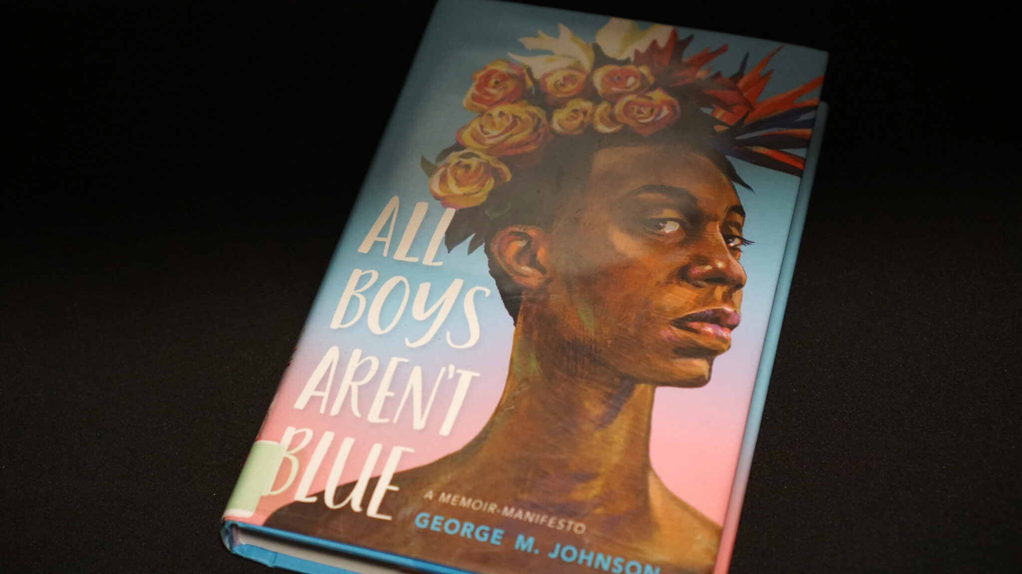 A copy of the often banned book All Boys Aren't Blue, a memoir manifesto by LGBTQIA activist George M. Johnson. 