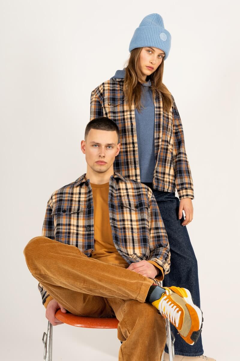 A man and woman in flannel shirts