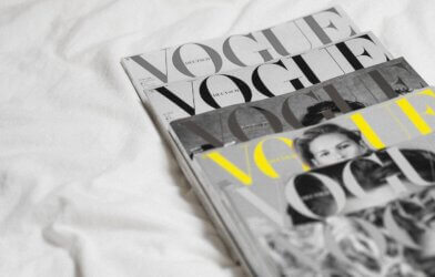 A pile of Vogue magazine issues