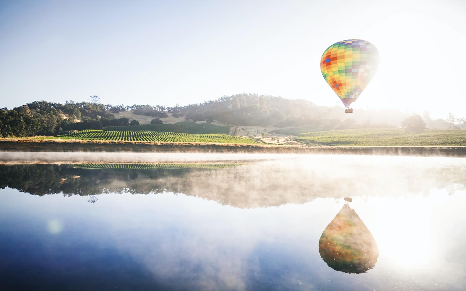 Hot air balloon floating over Napa Valley