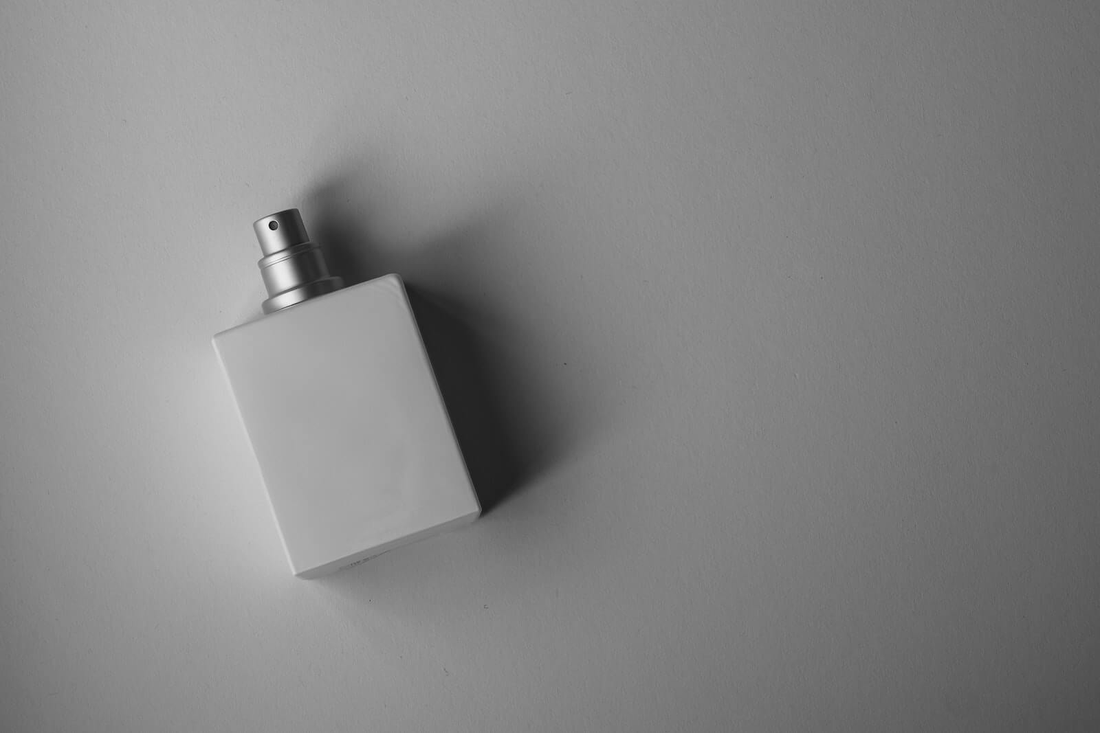 A white bottle of cologne