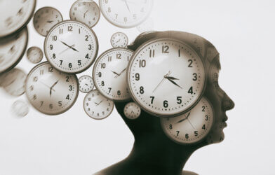A woman and clocks surrounding the mind
