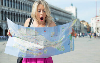 Tourist looking at city map