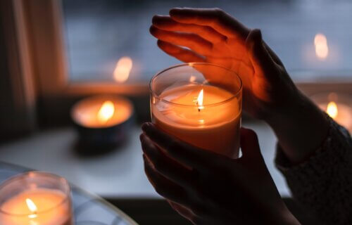 person holding lighted candle