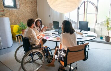 Person in wheelchair at office Meeting