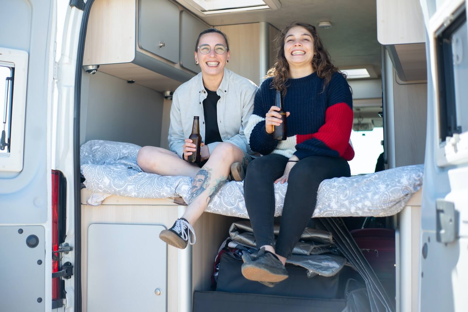 A couple sitting in an RV