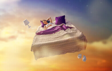 girl dreaming flying in her bed
