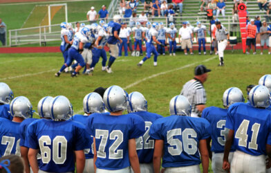 high school football team showing uniform numbers