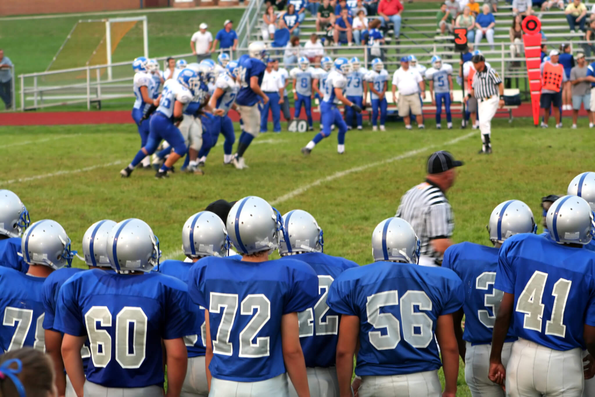high school football team showing uniform numbers