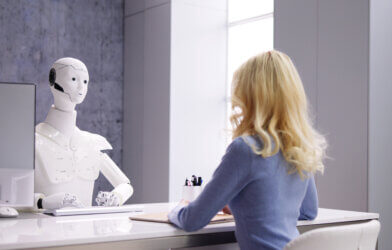 Woman at Interview With AI Robot Machine