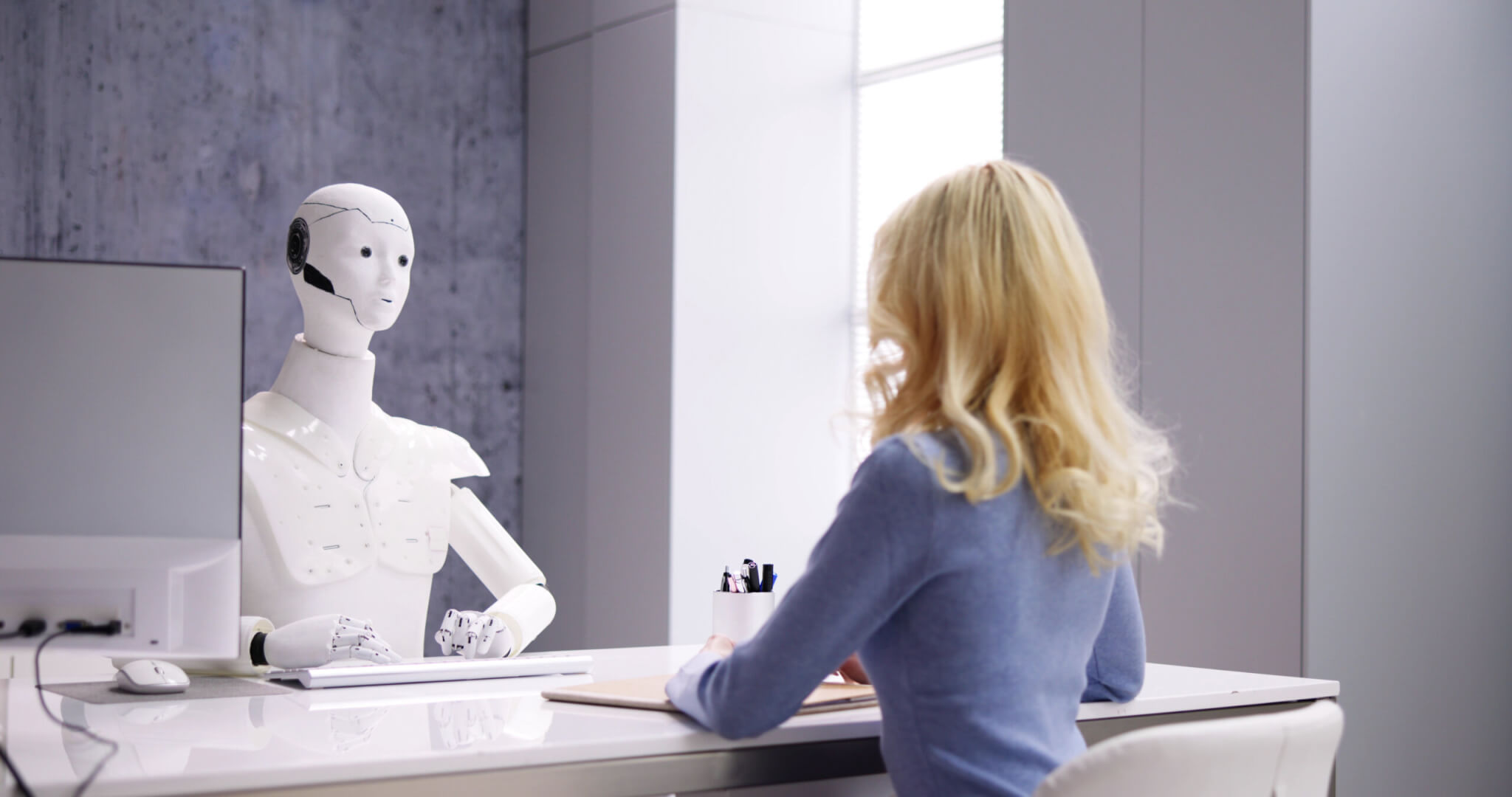 Woman at Interview With AI Robot Machine