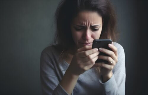 woman crying while using social media